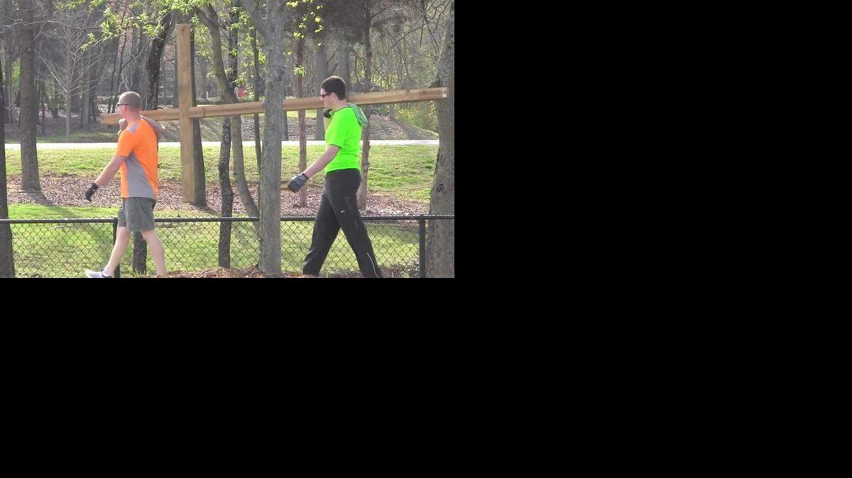 
Off duty officers Wayne Maury of the Rock Hill Police Department and Adam Sommerville of the Charlotte-Mecklenburg Police Department carried a 40-pound wooden cross through Rock Hill on Good Friday to demonstrate their faith.
