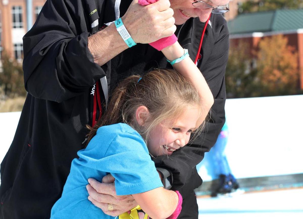 Cece Cooley, 7, skates with her grandfather Joe Puffer Wednesday at Rock Hill’s Holiday Ice Rink.
