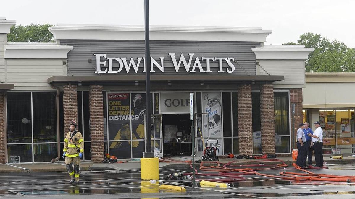 Fire investigators on scene Sunday morning May 1, 2016 at Edwin Watts Golf store in Countryside Plaza in Pineville where one firefighter was killed and one firefighter injured fighting a fire that happened on Saturday night.