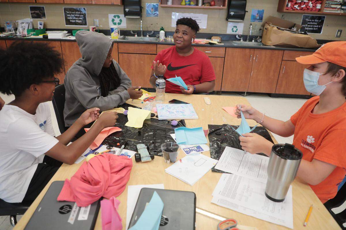 From left, Tyler Brice, 12, Indyah Hemphill, 13, Nick Andersen, 14, and Ethan Knowles, 14, work on a project Thursday at the Rock Hill Schools 2021 Exploration Summer Camp.
