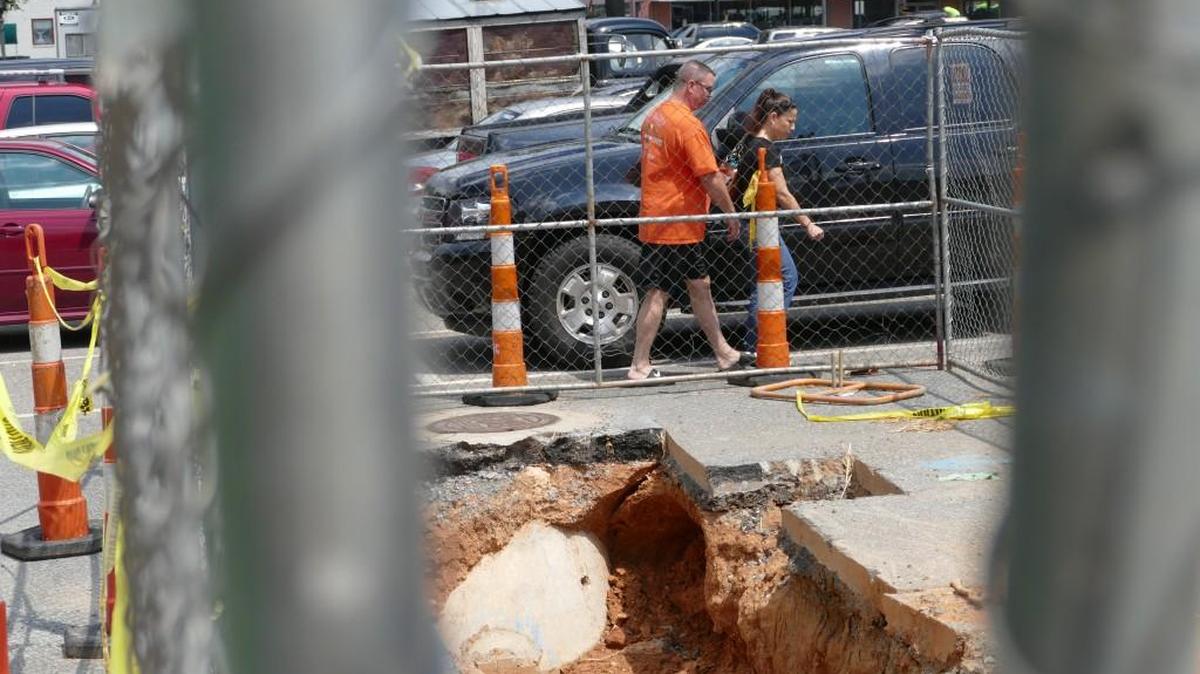 
Drivers in the White Street parking lot have to dodge construction work related to the apartment construction at 139 Main. More downtown development could lead the city to replace the lot with a parking deck.
