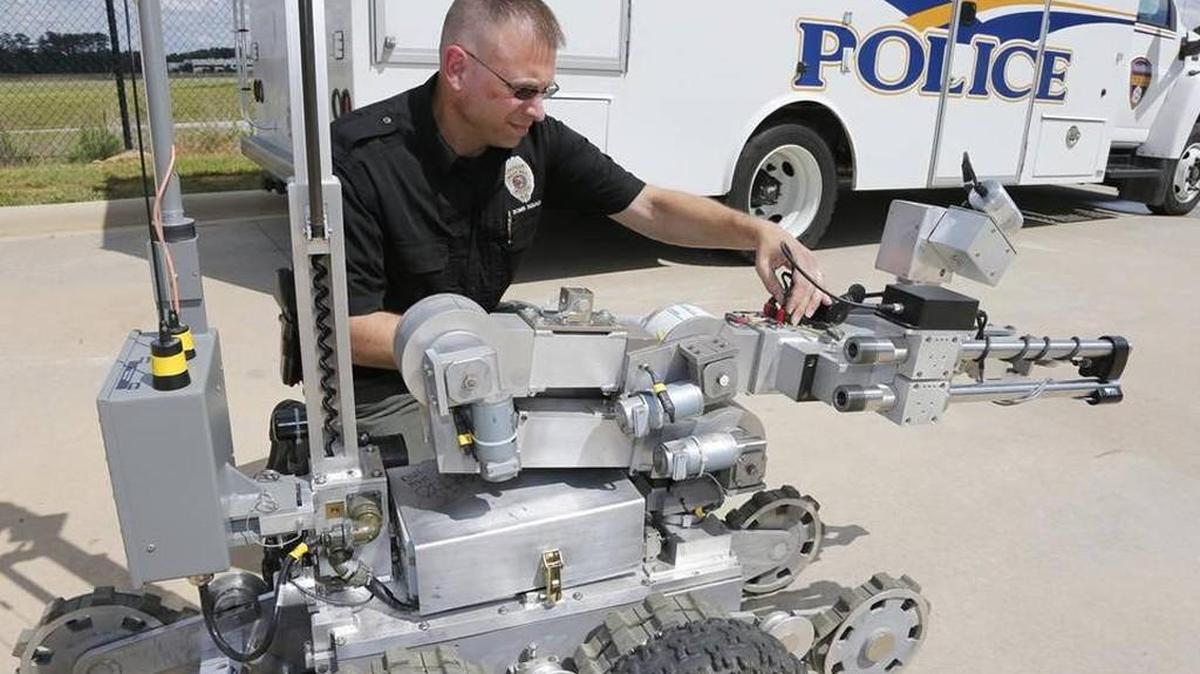 Rock Hill Police Department bomb squad member Lt. Matthew Hall examines one of the agency’s bomb robots. The bomb squad and robots will be featured during a summer camp hosted by the York Police Department that allows children to learn from a variety of local emergency response agencies.