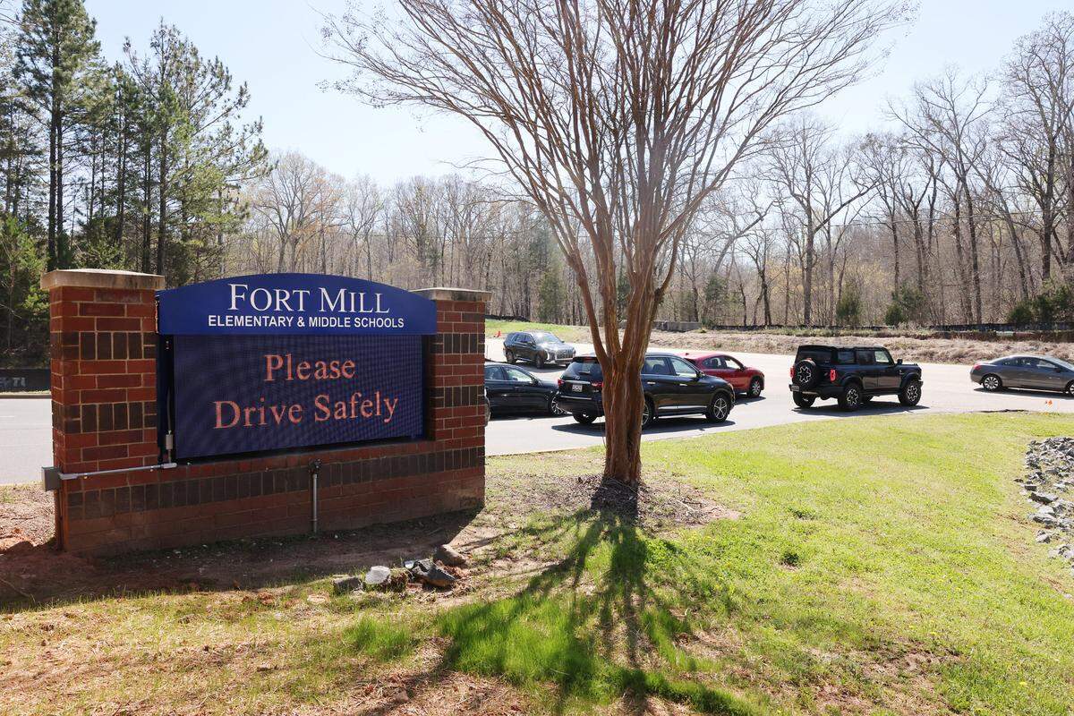 Traffic stops in front of the entrance of Fort Mill Elementary and Middle Schools Friday as middle school lets out. Concerns for students and crossing guards flared up in the district after a guard was struck and killed working at the schools March 21.
