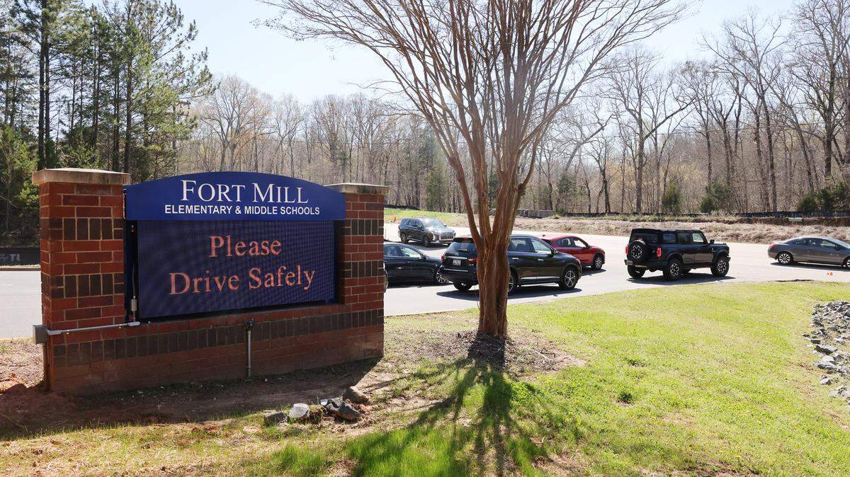 Traffic stops in front of the entrance of Fort Mill Elementary and Middle Schools Friday as middle school lets out. Concerns for students and crossing guards flared up in the district after a guard was struck and killed working at the schools March 21.