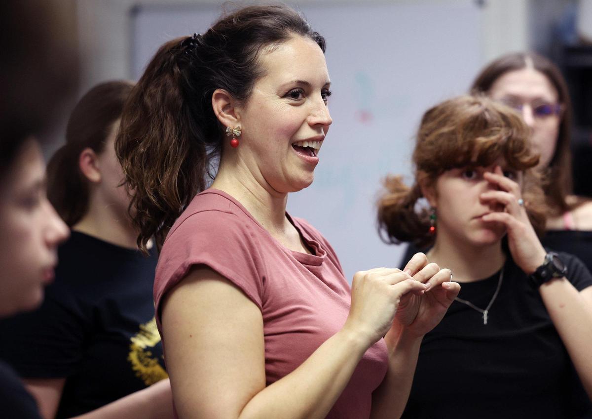 Jennifer Read, owner and director of Showtime Academy and Showtime Theatre Company talks to students during a rehearsal in December