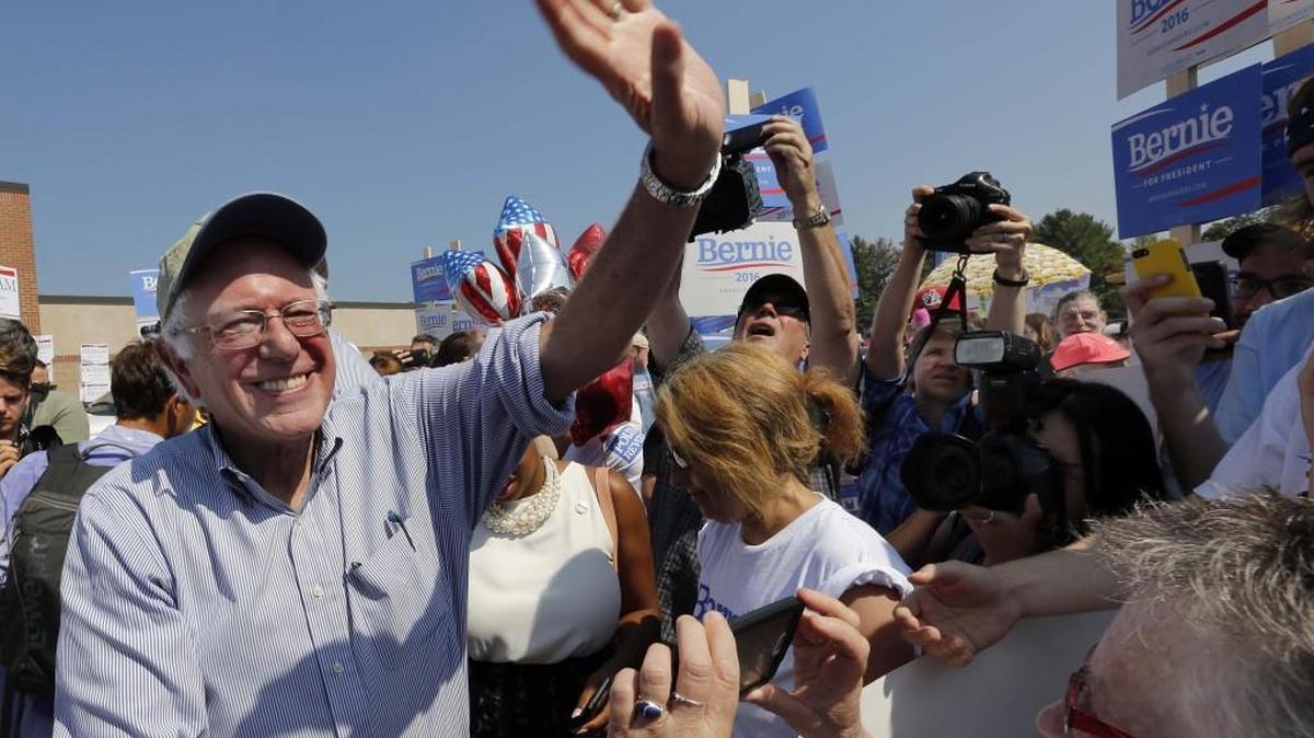 
Democratic presidential candidate Sen. Bernie Sanders, I-Vt, is swarmed by supporters as he arrives to march in the Labor Day parade Monday in Milford, N.H. 

