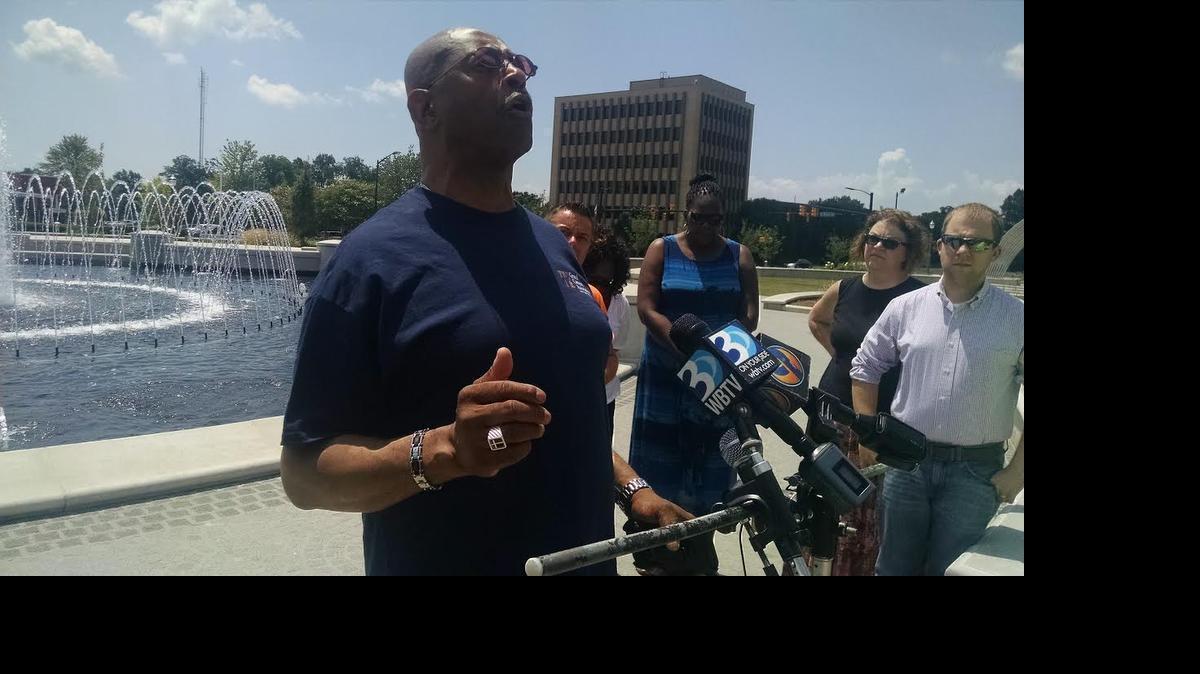 
Rev. Ronal King of Christians Feed the Hungry gives the benediction for an impromptu prayer vigil in Fountain Park on Thursday for the victims of the mass shooting in a Charleston church on Wednesday night.
