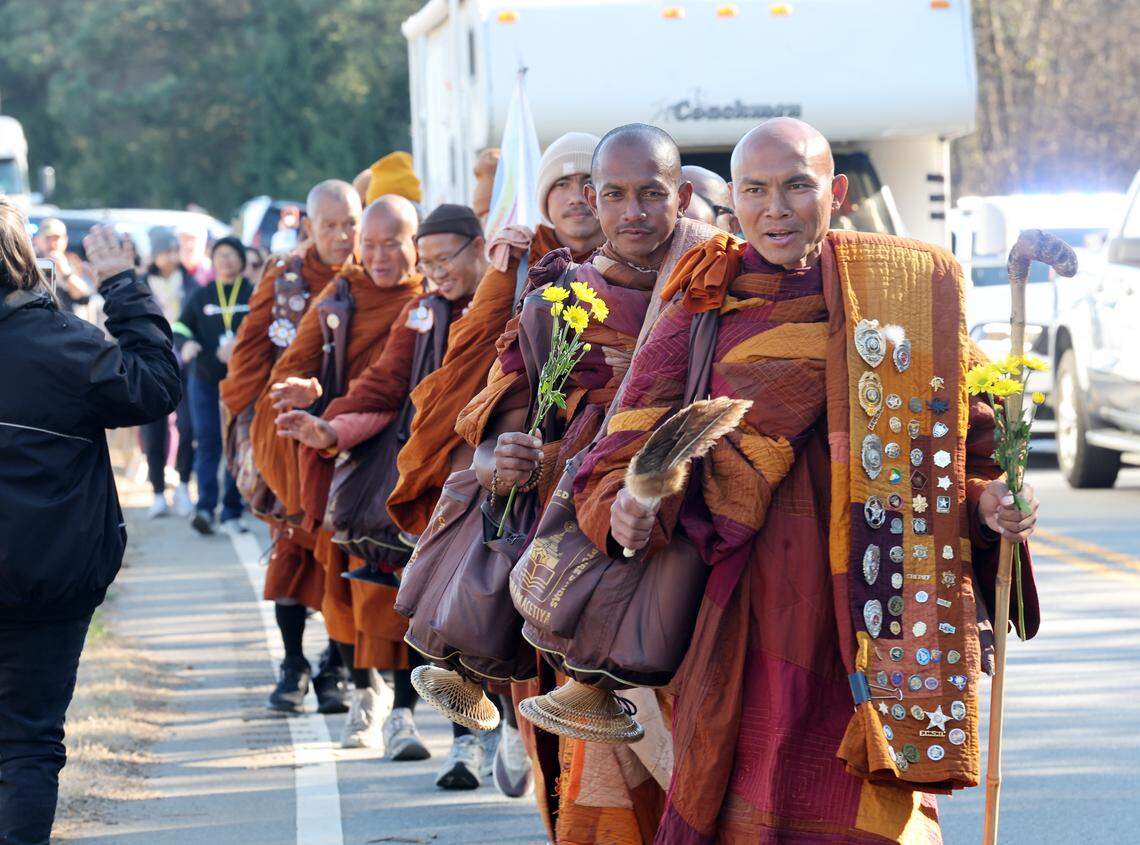 Buddhist monks on their way from Texas to Washington, D.C. walk through Chester County, S.C. on their way to Rock Hill Tuesday. The group will be in Charlotte Wednesday or Thursday.