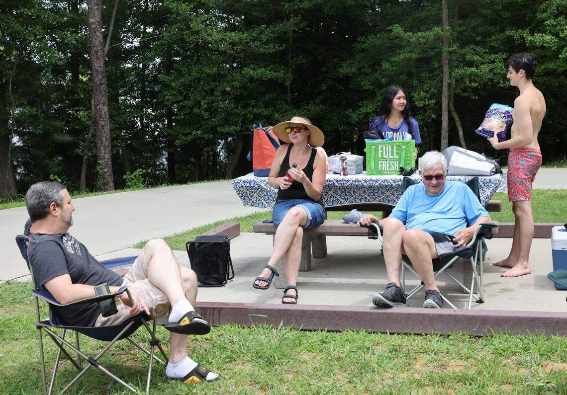 A group of visitors at Rock Hill Lake Park have a picnic this month. The park has a swim beach, a first for the city parks and recreation department.