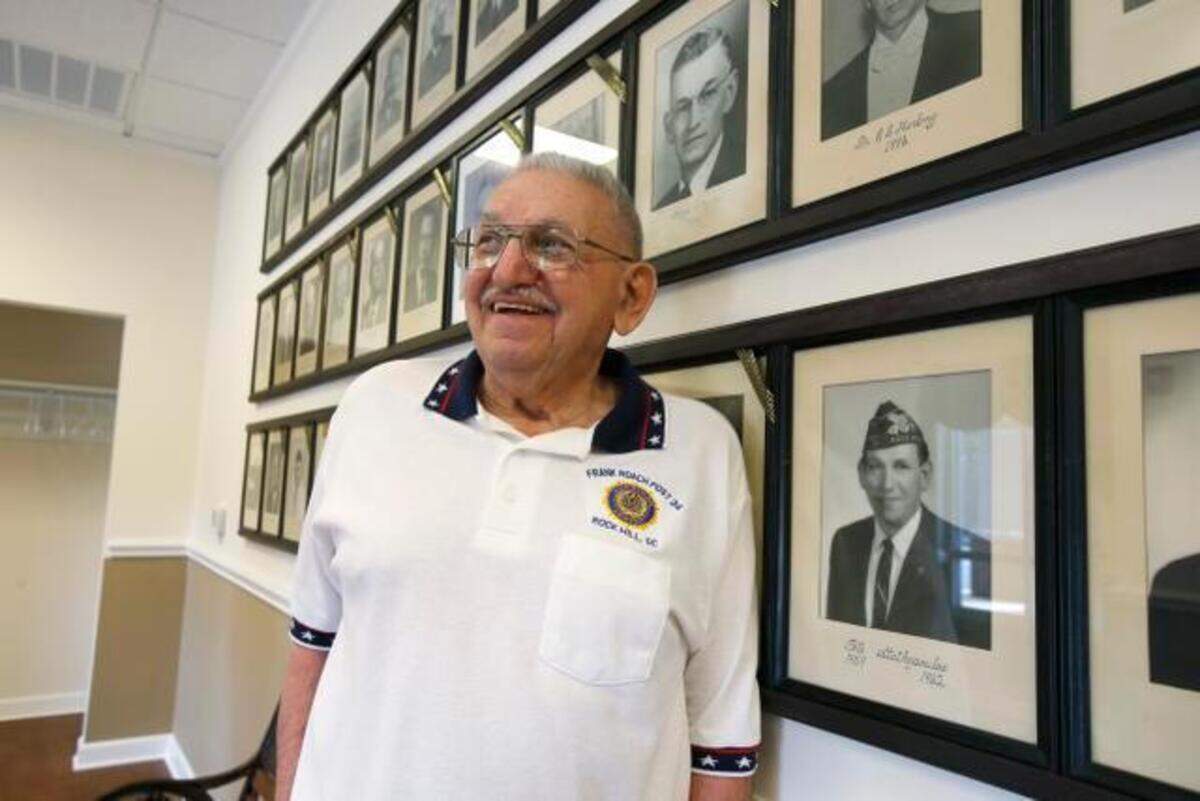 The American Legion Frank Roach Post 34 has opened their new building at 524 Heckle Blvd. in Rock Hill. Legion member Pete Stathopoulos stands next to his picture from when he was post commander in 1959-1962. Pete ran the York County Fair for years at the old Legion Fairgrounds on Cherry Rd. Portraits of past commanders are displayed in the main entrance of the new post.