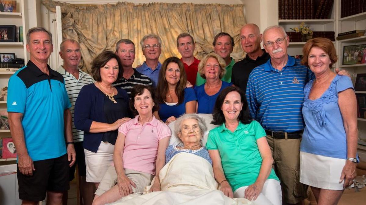 92-year-old Margaret Coleman, center, sits with her 14 children, from left, Rich Coleman, 55, Mike Coleman, 65, Diane Morris, 53, David Coleman, 54, Maribeth Rice, 61, Tom Coleman, 63, Cathleen Loch, 51, Dan Coleman, 47, Patty Griffin, 57, Maureen Kelly, 61 (twin to Maribeth), Tim Coleman, 62, Terry Coleman, 58, John Coleman, 67, and Peggy Cahill, 60, at the Coleman family home Sunday, July 24, 2016, in Chicago. In addition to her 14 children, Margaret Coleman currently has 48 grandchildren and 13 great-grandchildren.
