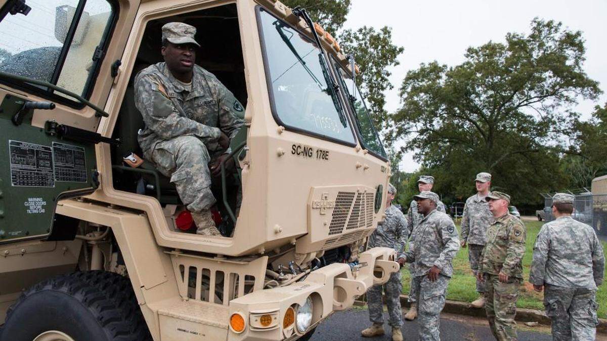In this October 2016 file photo, PFC Albert Neely sits in a truck that his company has been training with as the South Carolina Army National Guard 1222 EN Company (SAPPER) readies for deployment to the coast for Hurricane Matthew.
