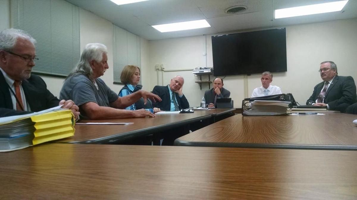 Danny Simmers meets with York County officials Monday about his status on the county’s mental health board. Pictured, from left, are Dr. Paul Cornely, executive director with the Catawba Mental Health Center; Simmers; citizen Kris Frazier, County Manager Bill Shanahan; finance and operations committee members Bruce Henderson, Michael Johnson and Robert Winkler.