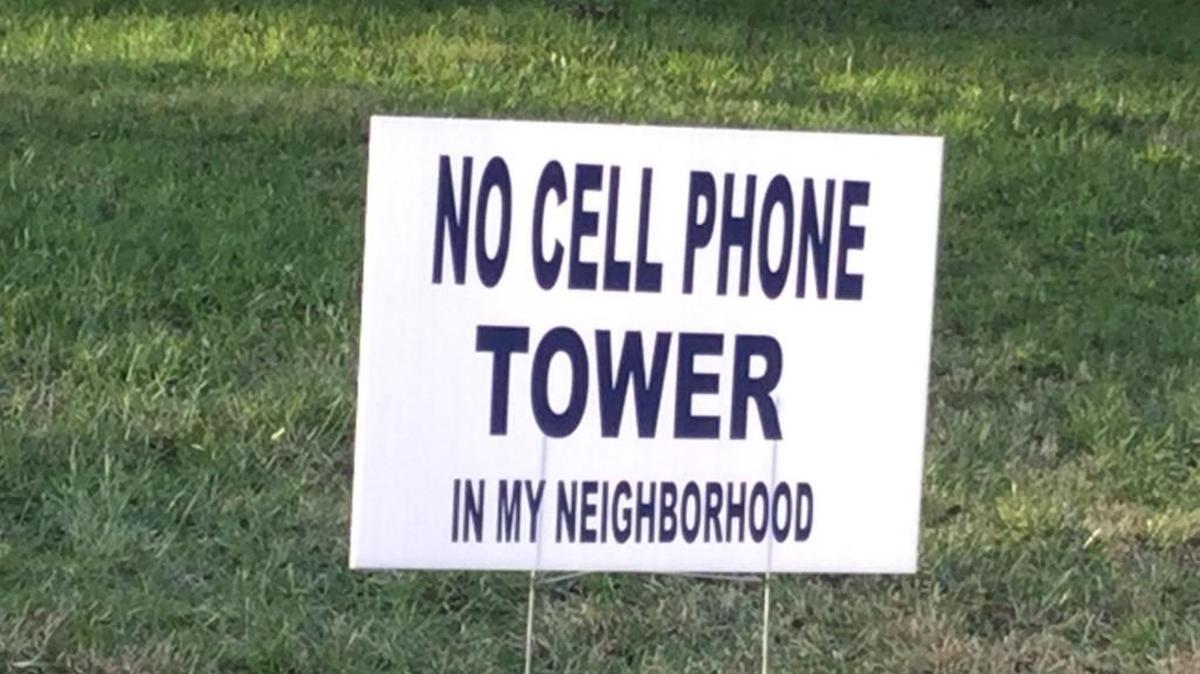 A sign opposing plans to build a cell phone tower in Clover is posted across the street from the proposed tower site.