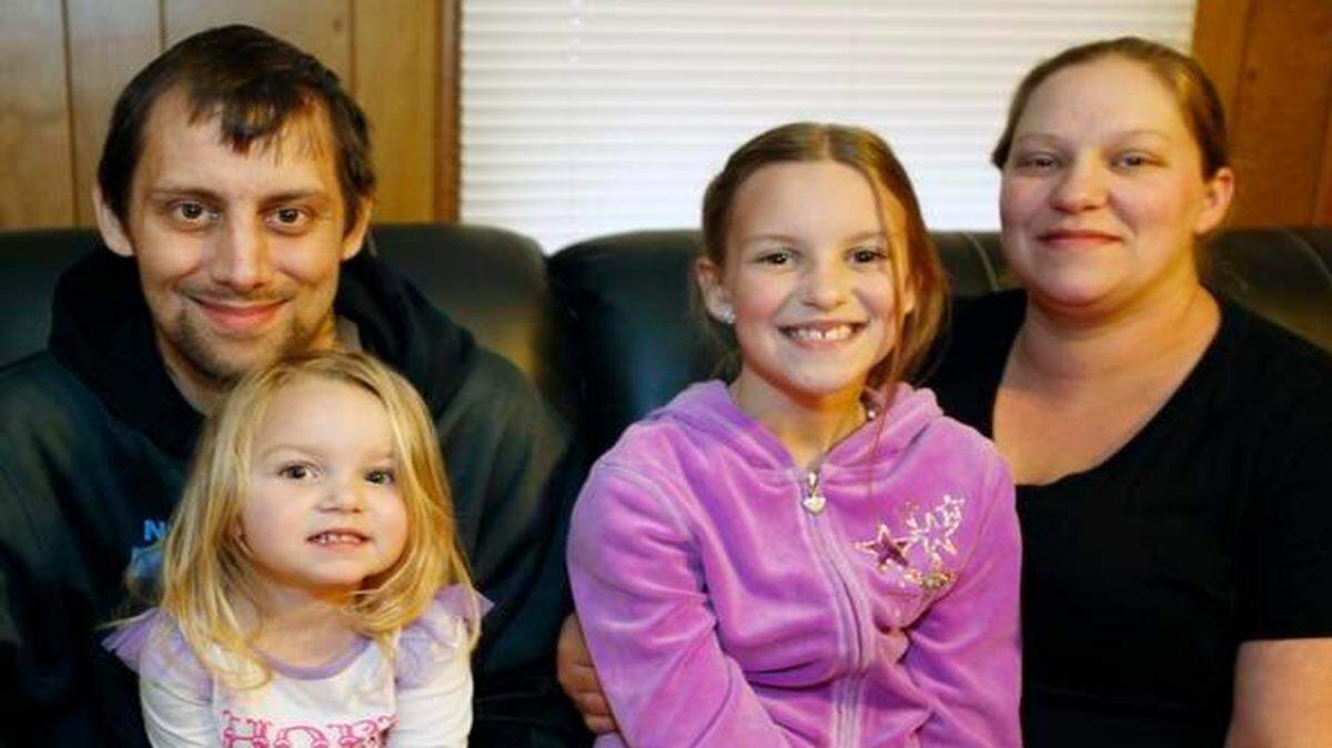 
Heart- and lung-transplant recipient Richard Jenkins poses with daughters McKinley, 2, and Chloe, 8, and wife, Laura, at their home in Rock Hill.
