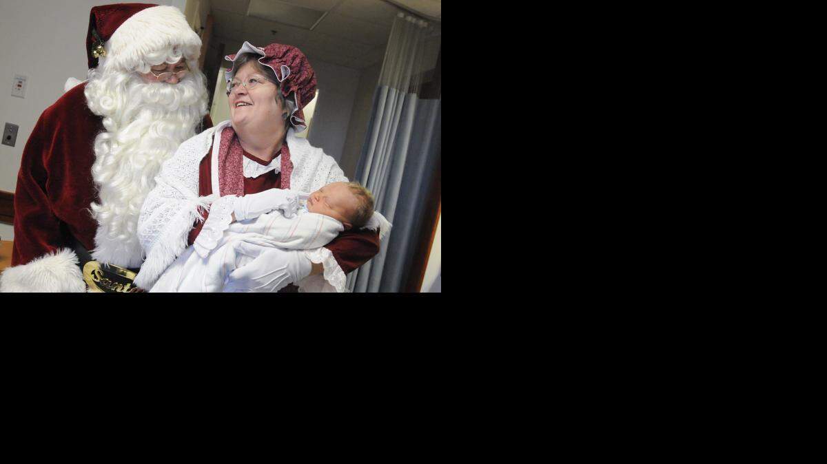 
Santa and Mrs. Claus (Klaus and Janie Schmolke) visit newborn Ryan Blake Moss, born on December, 22, 2009, at Piedmont Medical Center. The two had a tradition of visiting children in the hospital on Christmas Eve. 
