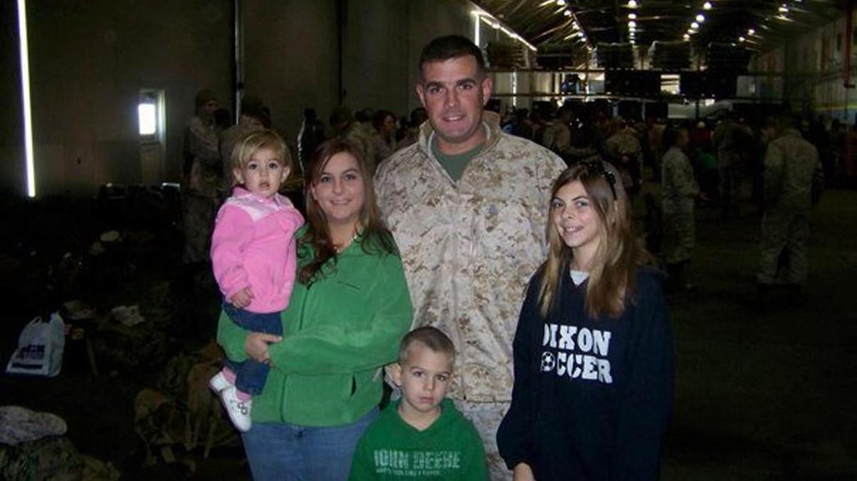 The Dudley family before Marine T.J. left for his last deployment before he was killed in action in Afghanistan in 2011. Wife Mary holds baby Jenna, Carter in front, Taylor, right.