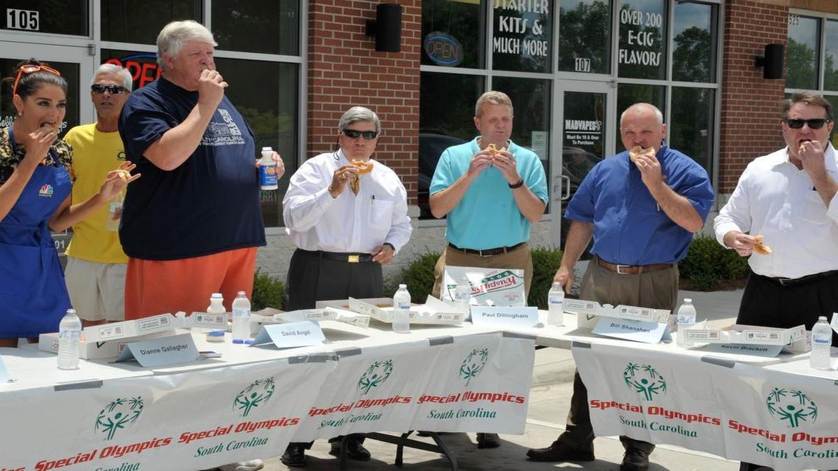 
Local celebrities participate in a doughnut-eating contest Thursday at Krispy Kreme on Celanese Road to benefit Special Olympics.
