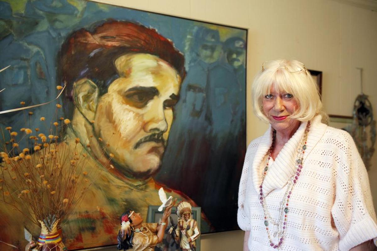 File photo of Myra McCants, mother of slain York County deputy Brent McCants, at her home in Lancaster with a portrait of her son.