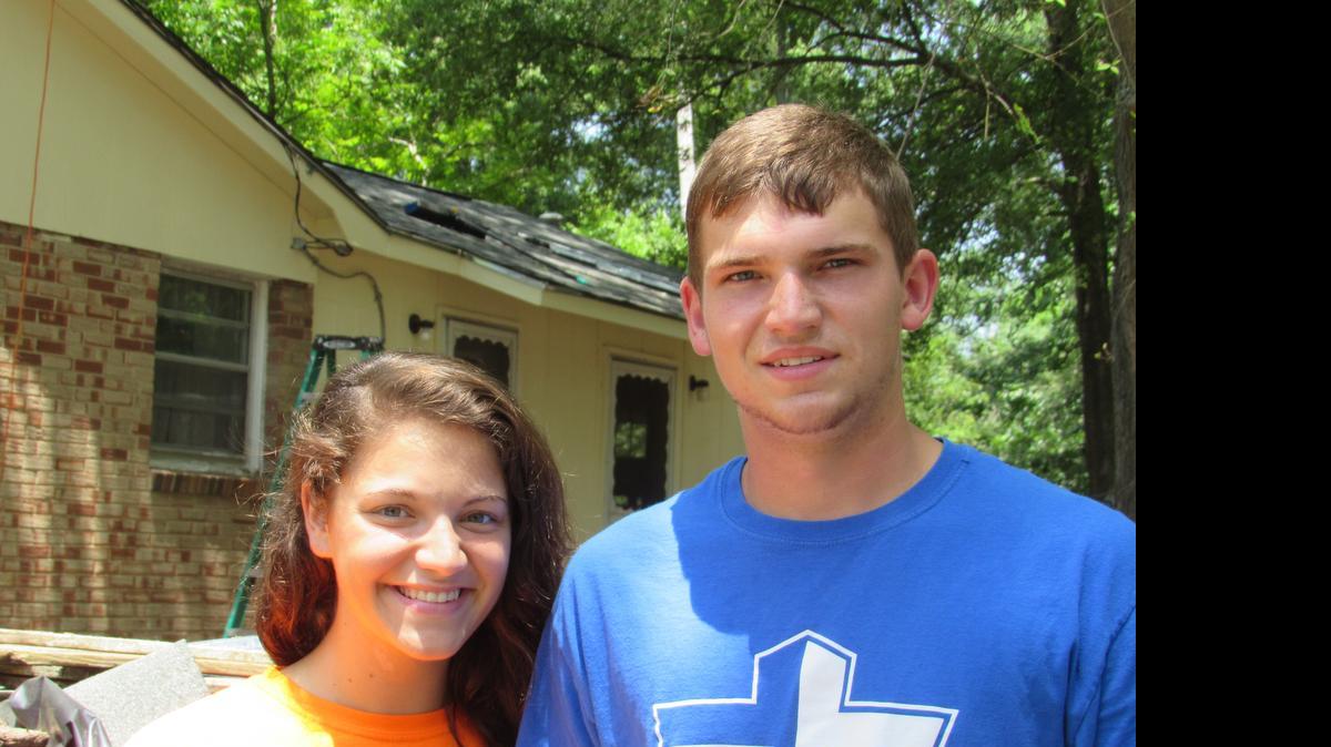 
Kaci Chambers and Kyle Dills worked on the home of John and Mildred Watson feeling the need to help people after the killing of nine black people in Charleston by a white gunman. 
