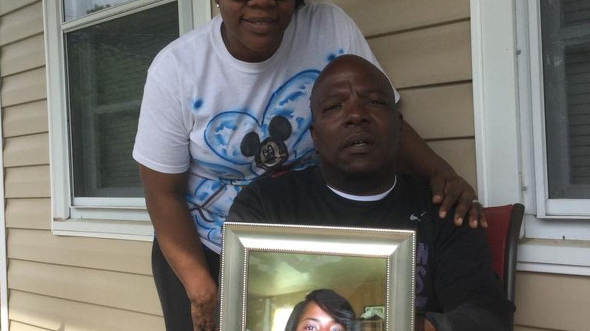 Liz McKnight and William Cureton are the aunt and uncle of murder victim Latoya Cureton, pictured in framed photo. The family is holding a second march for justice Saturday.