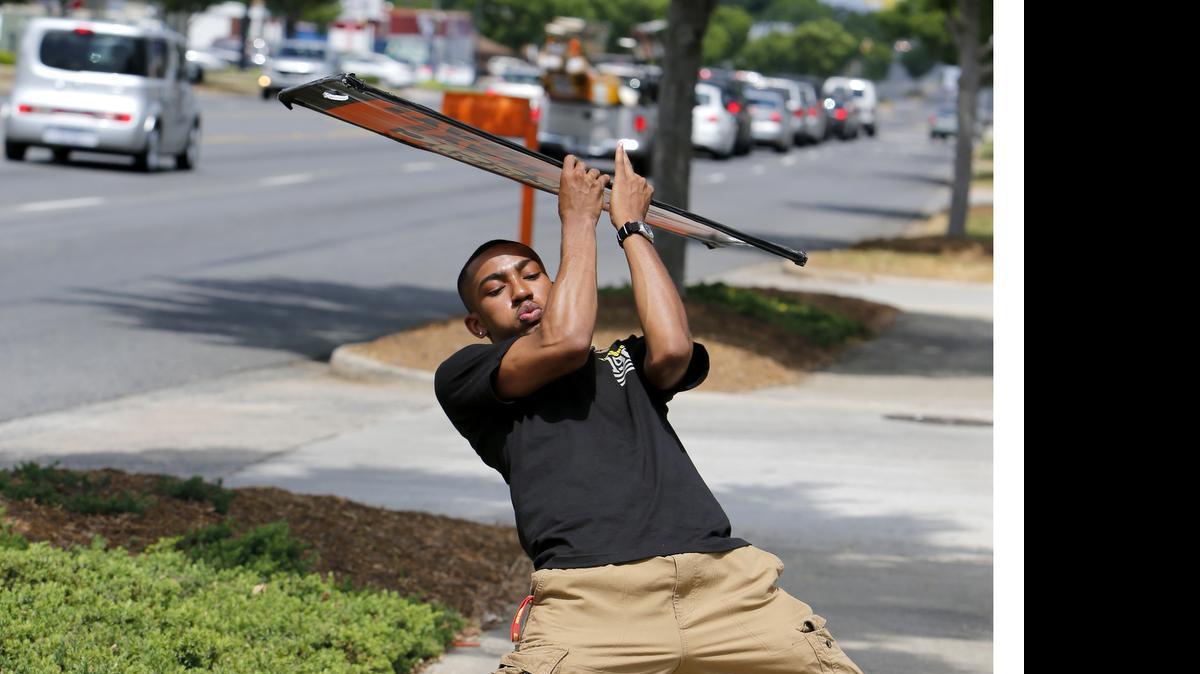 
Justin White of Rock Hill will compete May 20 in the Little Caesars Shaker Board Contest in Las Vegas. He is shown here dancing May 18 on North Cherry Road in front of the Rock Hill Little Caesars Pizza restaurant.
