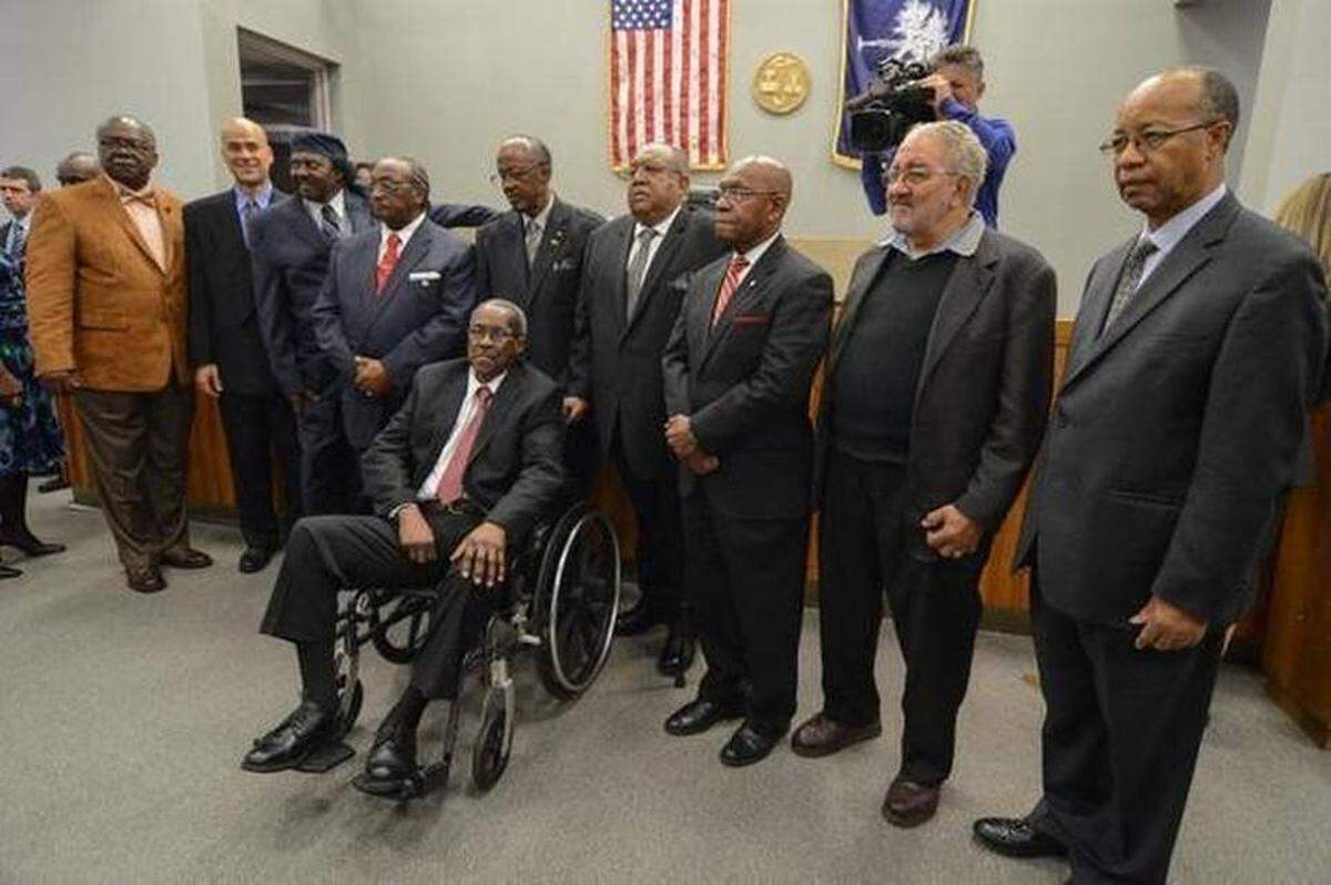 The surviving members of the Friendship Nine and other civil rights protesters gather after a January 2015 court hearing during which their 1961 convictions were overturned.