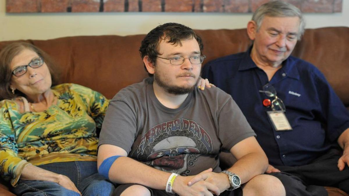 
Alex Creighton and his parents. 

