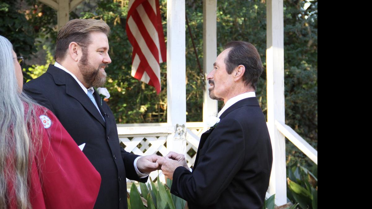 
Mike Goforth, left, and Jim Strickland say their wedding vows.
