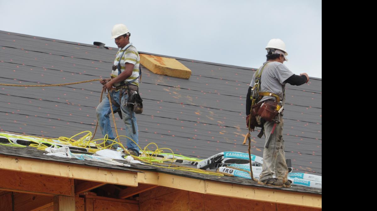 
Jose Montez, left, and Manuel Sanchez, immigrants from Mexico, working at a construction site in Fort Mill. The men are upset that presidential candidate Donald Trump categorized Mexican immigrants as criminals.
