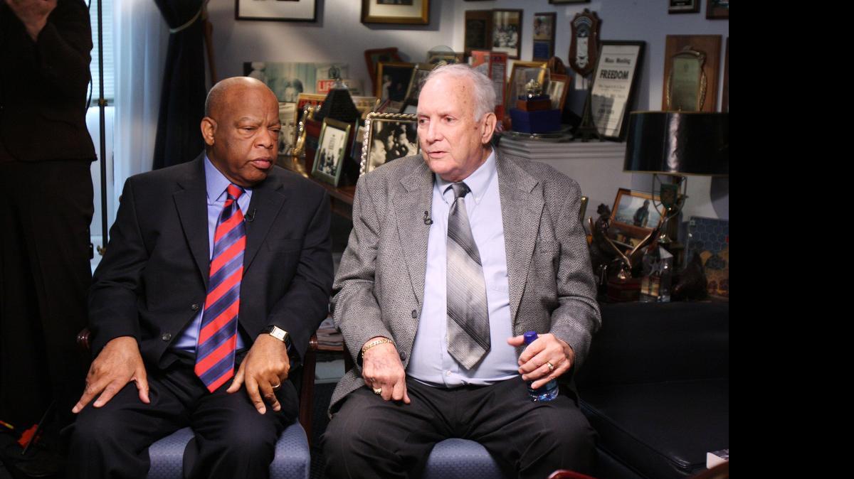 
U.S. Rep. John Lewis talks with Elwin Wilson of Rock Hill in Lewis' Washington, D.C. office in 2009 before a television interview
