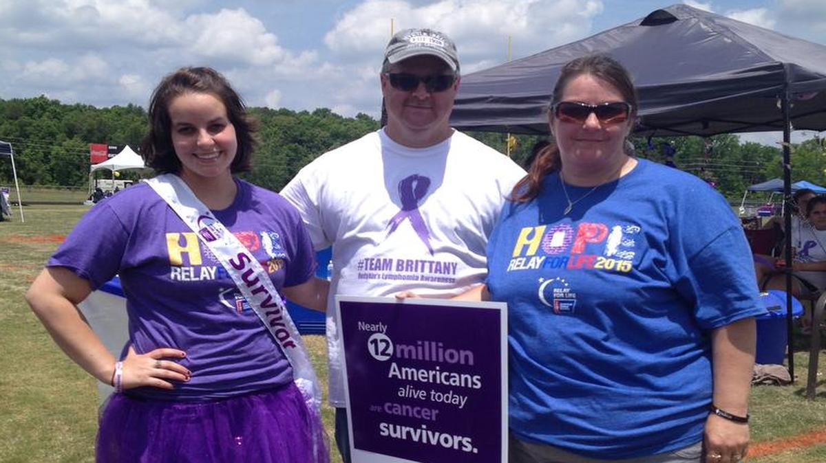 
Cancer survivor Brittany Hill , left, with her parents Todd and Amy at Saturday’s Relay For Life. 
