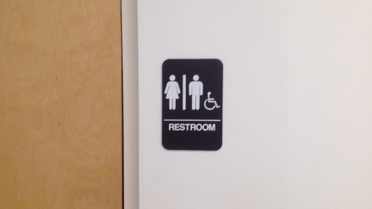 The sign for the one unisex restroom serving the York County Probate Court and passport office in York.