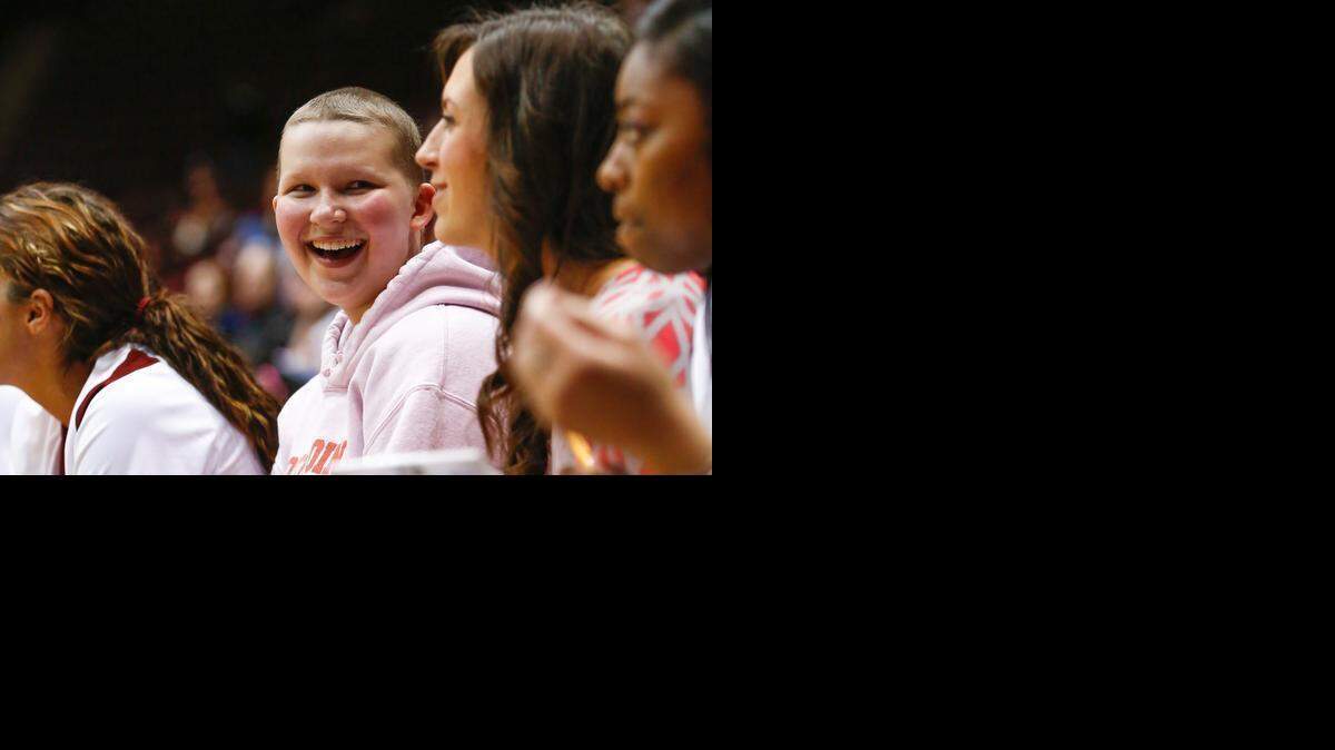 
Emily Elkins assumes the position of assistant honorary coach for the Winthrop Women’s basketball team as they host UNC Asheville in February 2014. 
