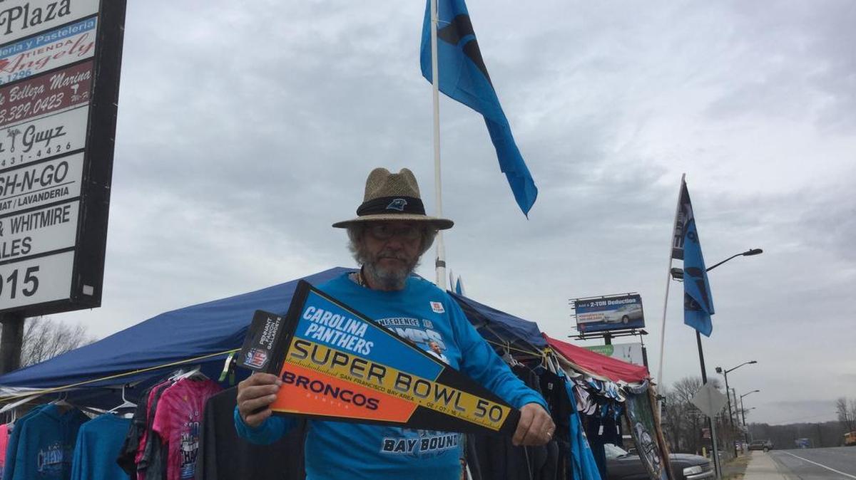 Robert Harper in front of his Carolina Panthers concession tent on U.S. 21 near the Catawba River Bridge in Rock Hill.