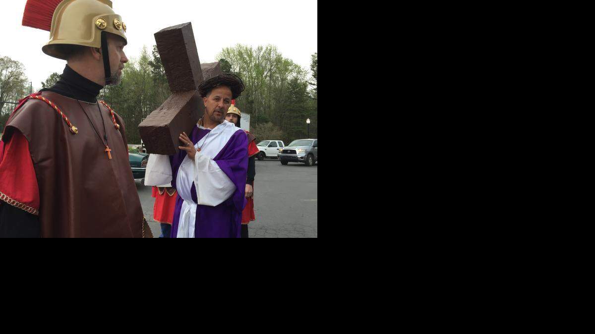 
Rev. Carl Williams of Fort Mill’s Lighthouse Pentecostal Holiness Church started his journey as Jesus Christ carrying the cross on Good Friday in Fort Mill. Williams and four church members playing Roman centurions walked miles along S.C. 160.

