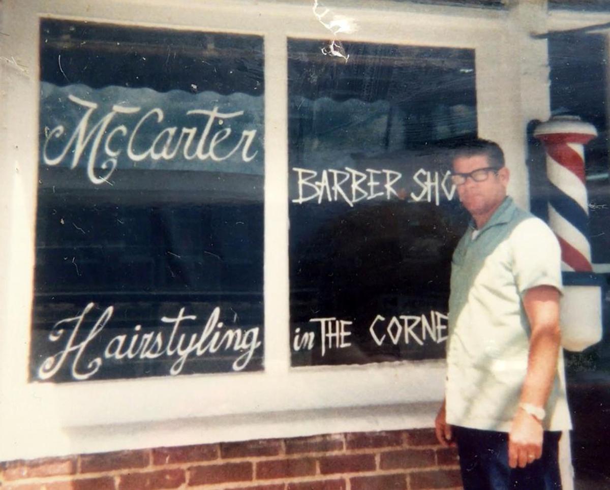 Duke McCarter outside his Clover barber shop sometime in the 1970s.
