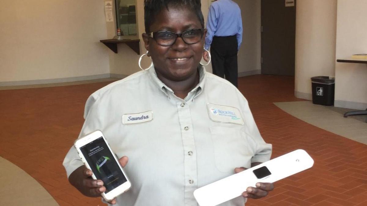 Saundra Hoyle displays the Apple Watch she received from a secret Santa.