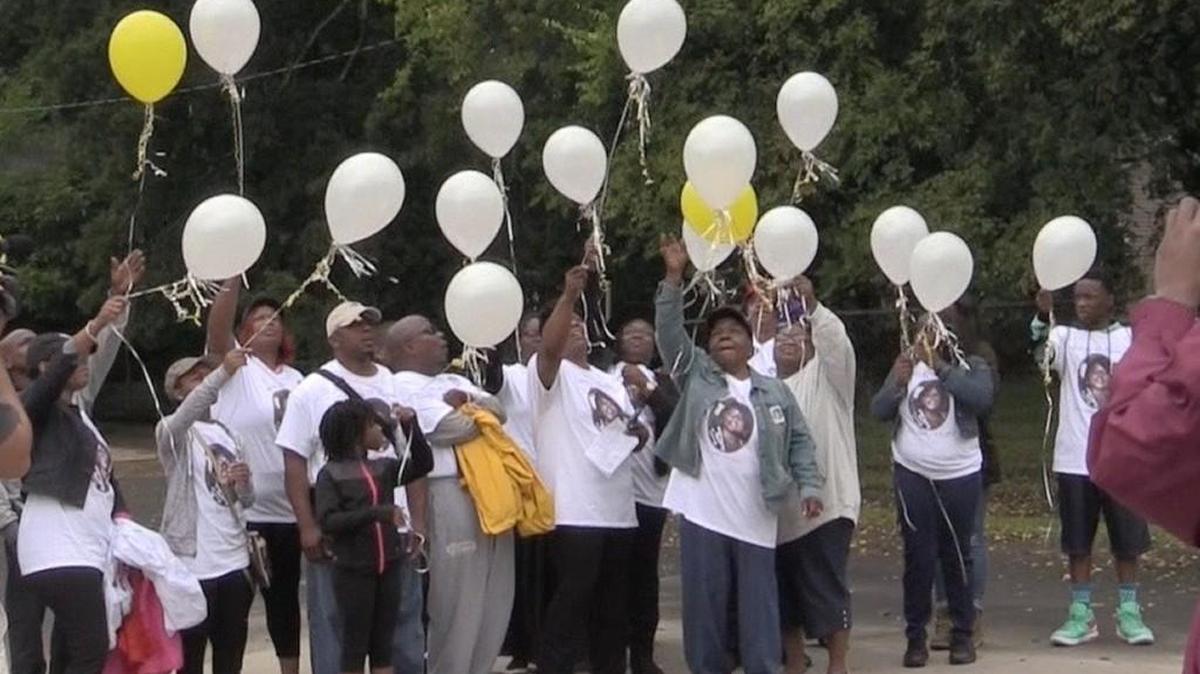 
Latoya Cureton’s family and friends released balloons in her memory Saturday following the march.

