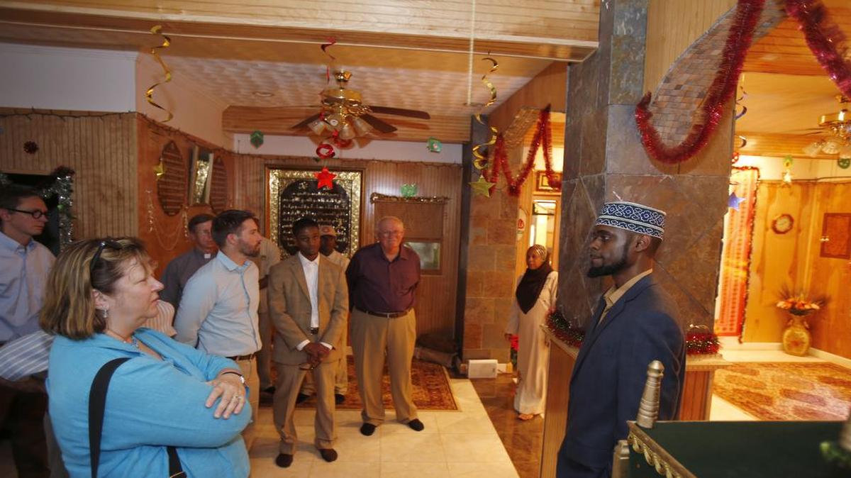 
Residents of Holy Islamville gave a tour and lunch Thursday to Christian ministers. Saeed Shakir, right, informal mayor of Islamville and the Imam of the community, speaks to the group of touring ministers.
