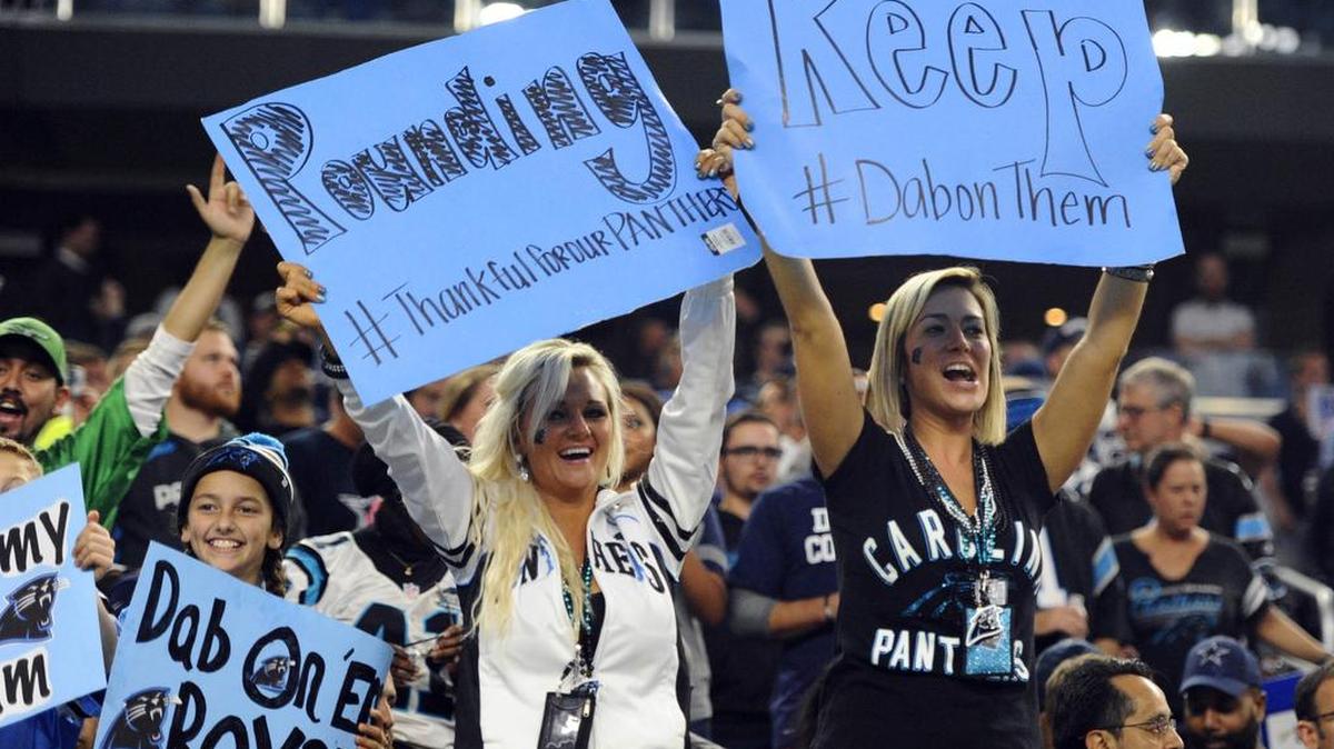 Carolina Panthers fans cheer for their team against the Dallas Cowboys at AT&T Stadium on Nov. 26, 2015. The Panthers won 33-14.