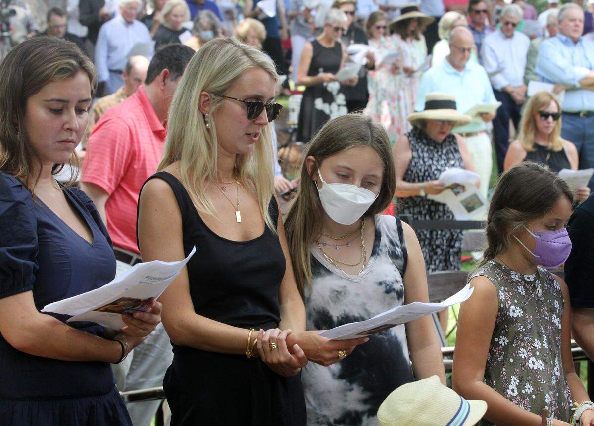Family members of Anne Springs Close sing a hymn Sunday at her memorial service in Fort Mill.