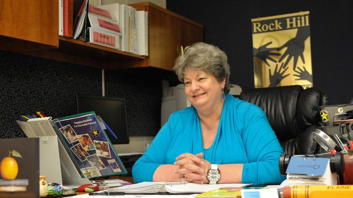 In this 2015 Herald file photo, Elaine Baker works in her office before her retirement from the Rock Hill school district.