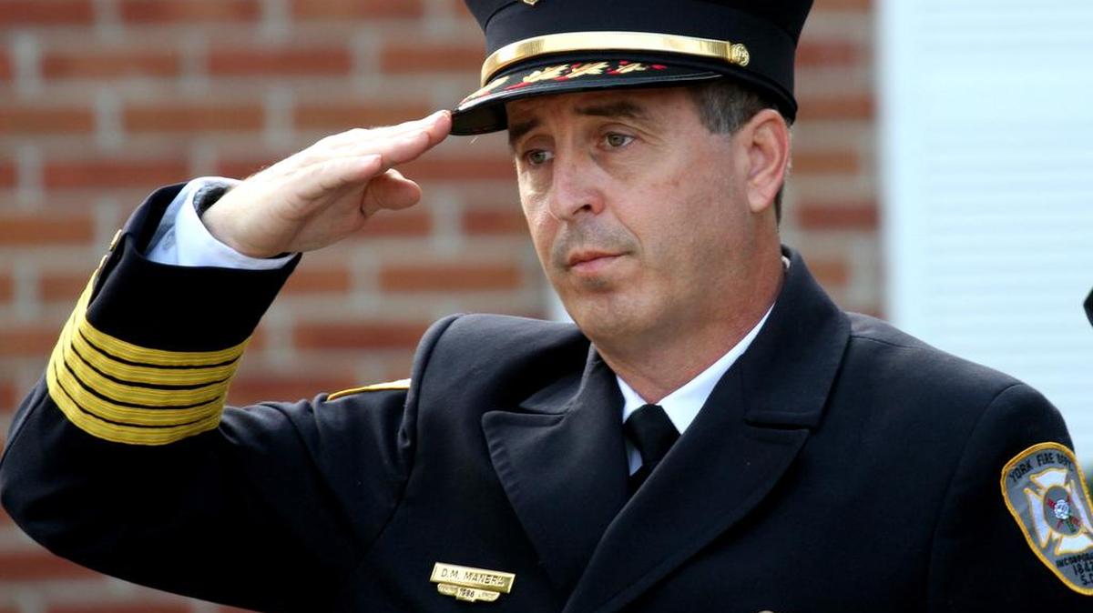 York Fire Chief Domenic Manera salutes during the Pledge of Allegiance Friday at the City of York’s 911 Memorial Service at City Hall.