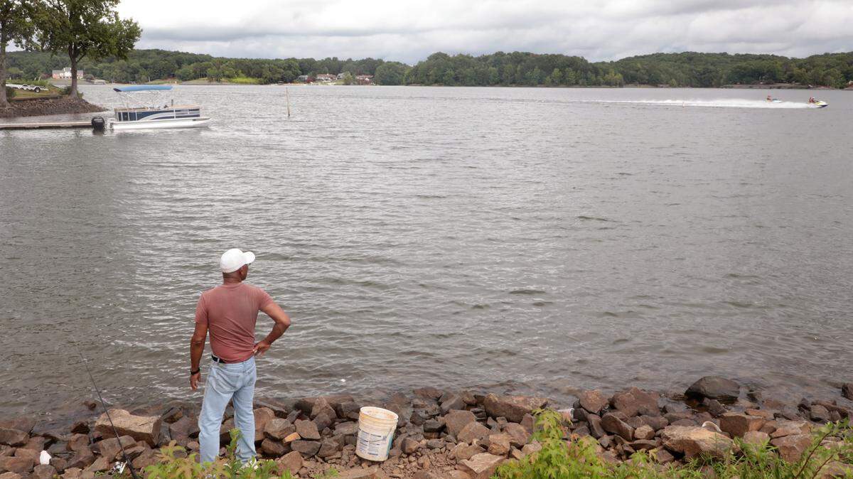 Billy Garrett fishes near the Buster Boyd Bridge Monday in Lake Wylie.