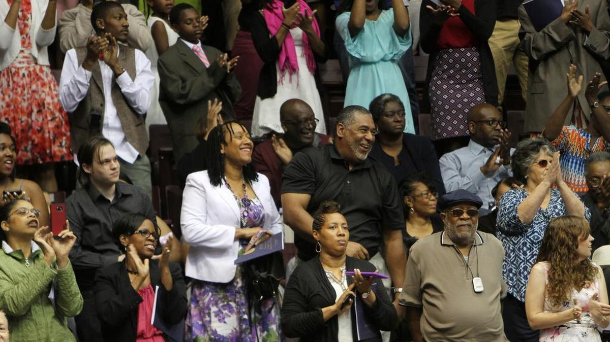 A crowd at Winthrop University's morning graduation ceremony cheers on Saturday.