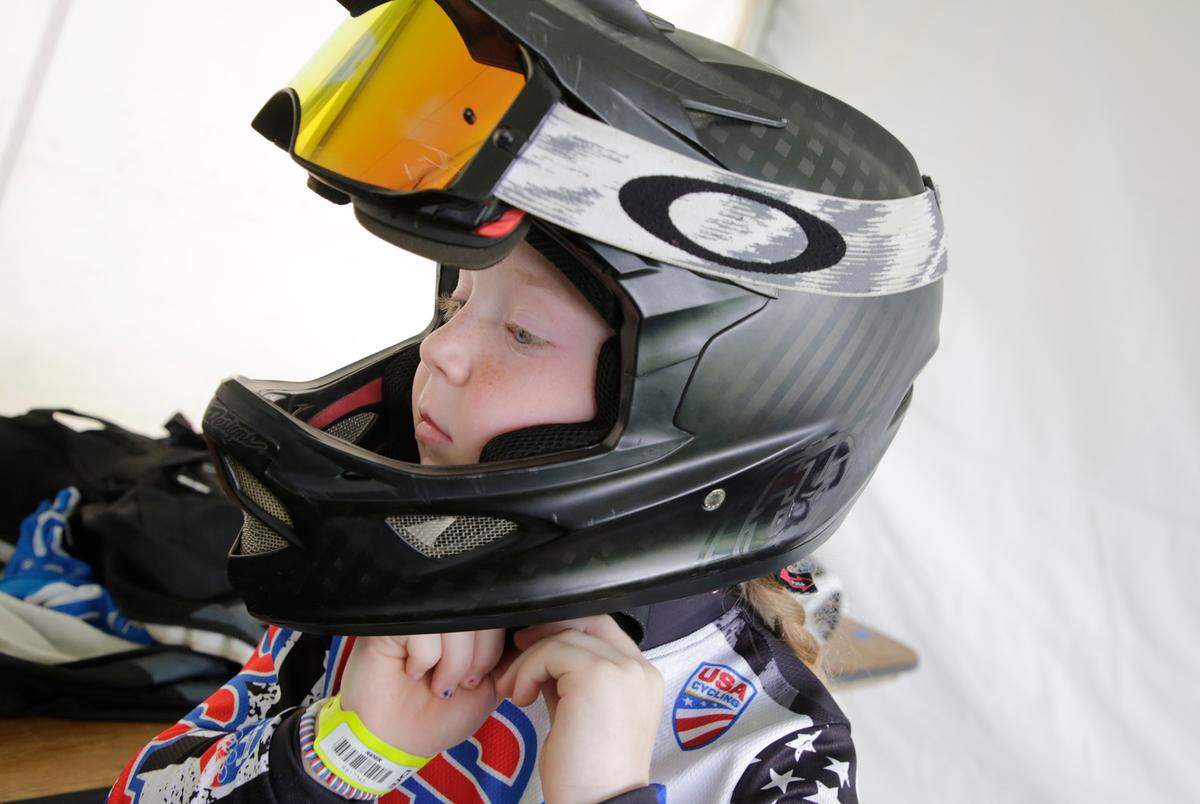 Irelyn McGinley adjusts her helmet Monday at the BMX World Championships in Rock Hill.