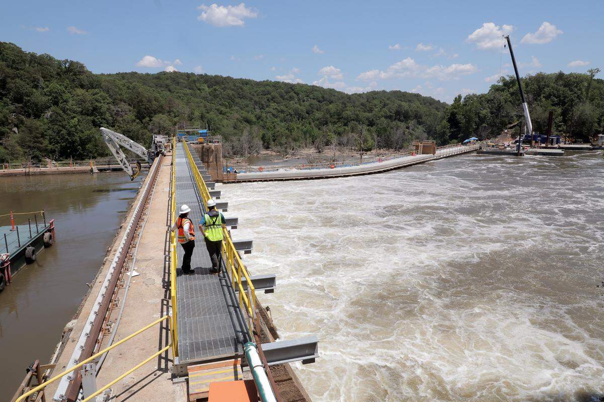 In this Herald file photo, Duke Energy recreation planner Christy Churchill, right, and manager of generation project engineering Michael Brissie stand on a platform over the Catawba River where crews brought water back to two river channels. Chester County has rezonings planned for hundreds of acres in the same area where a new state park is planned.