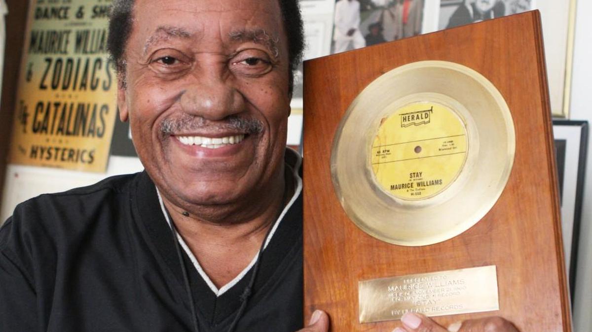 Maurice Williams holds his gold record for “Stay.”