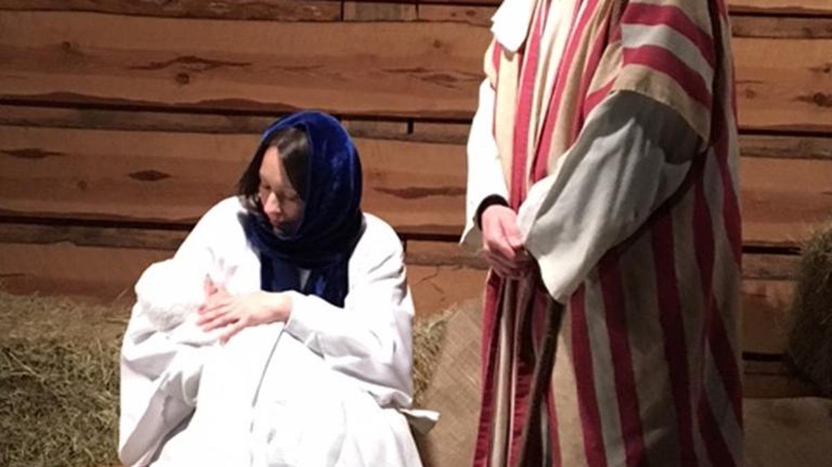 Amanda and Adam McGarity portray Mary and Joseph and their daughter Claire as Baby Jesus in the nativity at this year’s “Journey to Bethlehem” at St. John’s United Methodist Church in Rock Hill.
